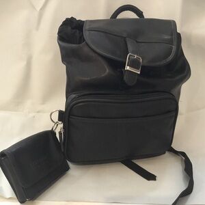 East Sport, New York. Backpack in black vinyl. Extra case attached.